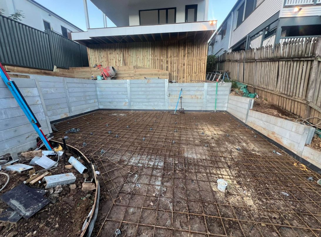 Backyard with steel mesh laid before the slab pour